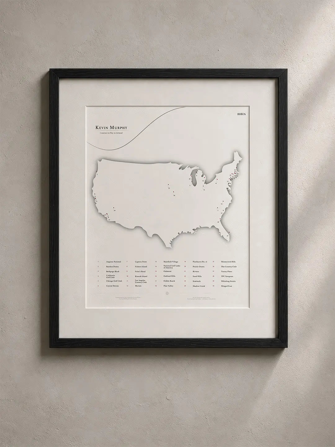 A framed BHÍOS map of the United States, personalised with a golfer's courses.